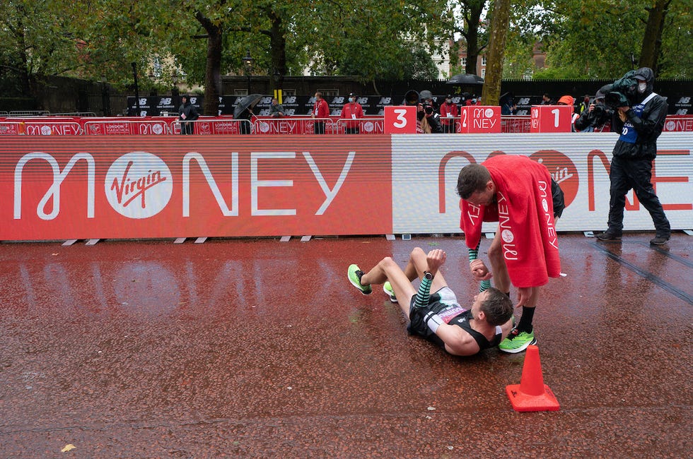 ben connor gbr on the floor after finishing the elite mens race the historic elite only virgin money london marathon taking place on a closed loop circuit around st jamess park in central london on sunday 4 october 2020

photo adam warner for virgin money london marathon

for further information medialondonmarathoneventscouk