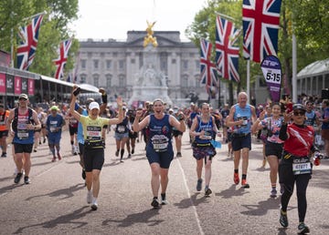 group of happy runners on the mall at the 2025 tcs london marathon