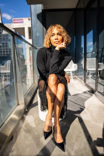 woman in black dress posing