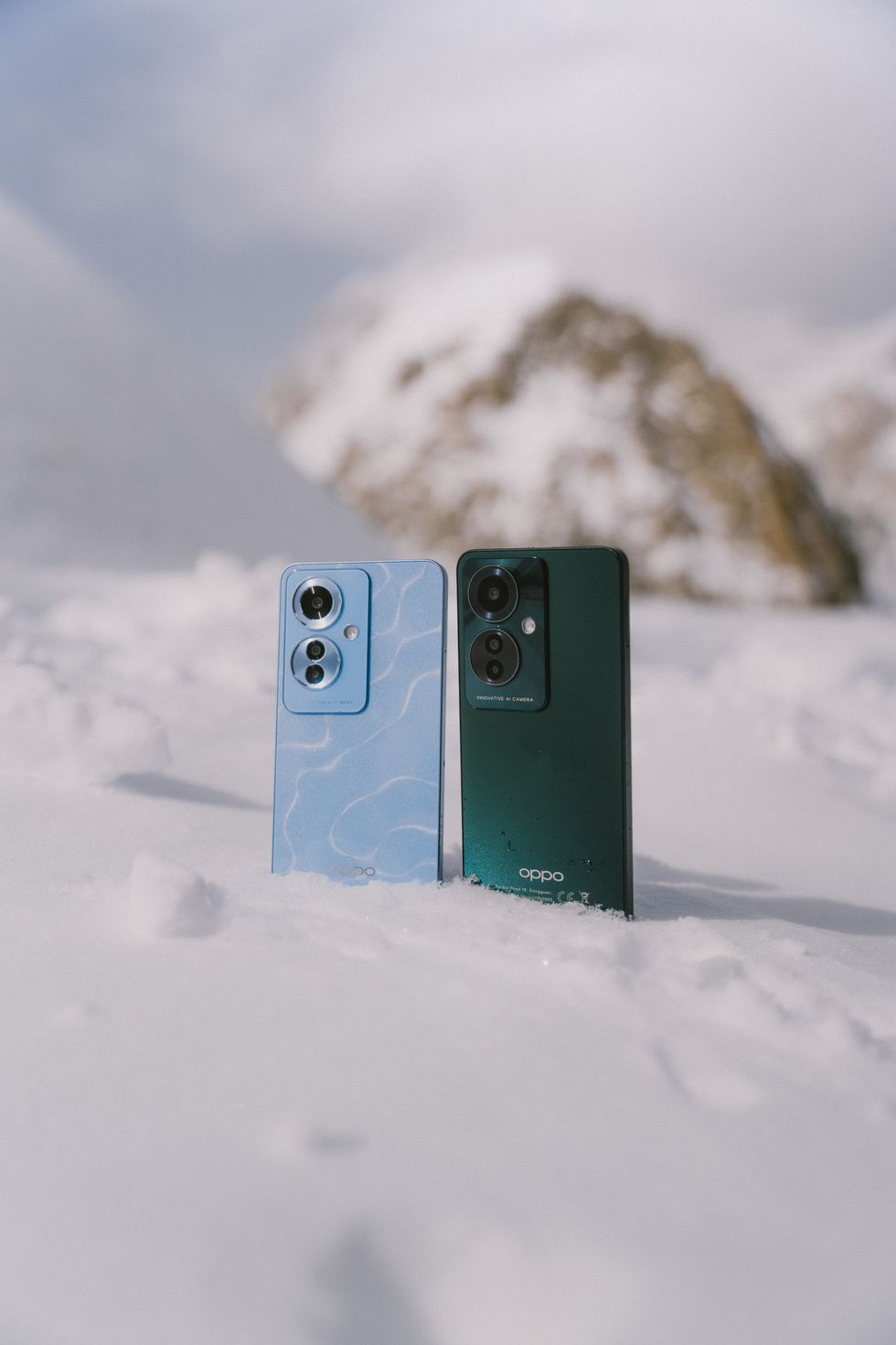a couple of blue rectangular objects in the snow