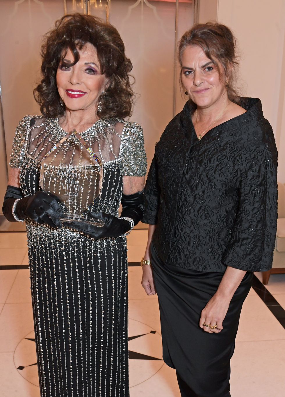 london, england   november 02  dame joan collins, winner of the icon award, and tracey emin attend the harpers bazaar women of the year awards 2021, in partnership with armani beauty, at claridges hotel on november 2, 2021 in london, england photo by david m benettdave benettgetty images for harpers bazaar