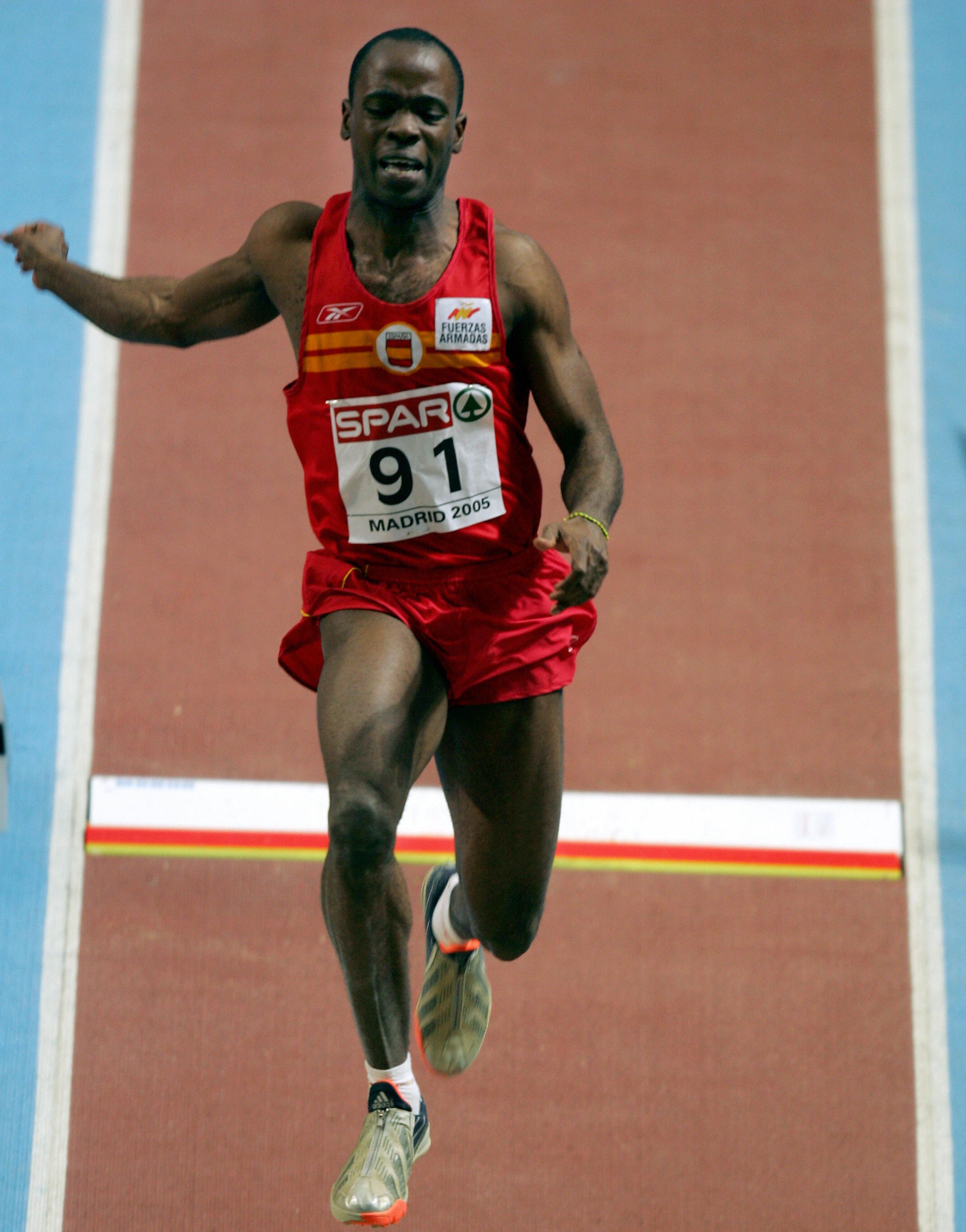 madrid, spain: spanish gold medalist joan lino martinez competes during the mens long jump finals at the european athletics indoor championships in madrid 06 march 2005. afp photo javier soriano (photo credit should read javier soriano/afp via getty images)