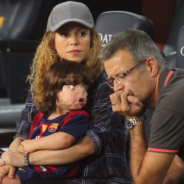 singer shakira, left, holds his son milan pique with father in law joan pique attending liga game in barcelona, spain, saturday, oct 18, 2014