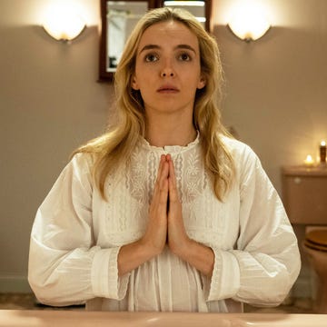 person in a bathroom performing a ritual or prayer person in a bathroom performing a ritual or prayer
