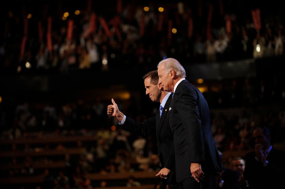 Beau Biden welcomes his dad, Joe Biden, at the Pepsi Center during the third day of the Democratic National Convention on August 27, 2008, in Denver, Colorado