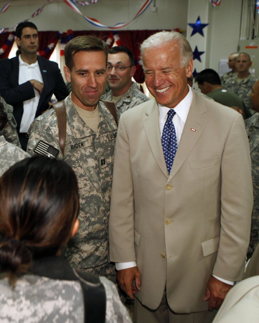 Joe Biden with his son, U.S. Army Capt. Beau Biden, at Camp Victory on the outskirts of Baghdad on July 4, 2009
