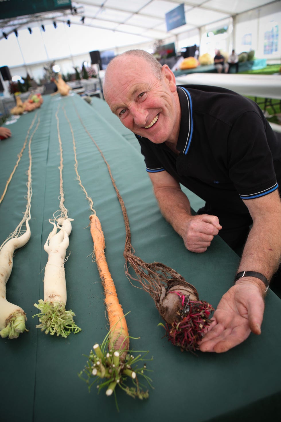 Joe Atherton with world record breaking beetroot, carrot and radish