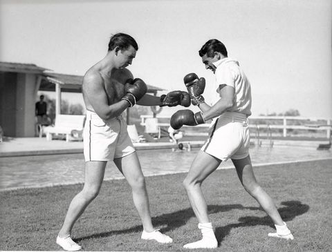 vintage celebs playing sports   joe lynch boxing with cary grant