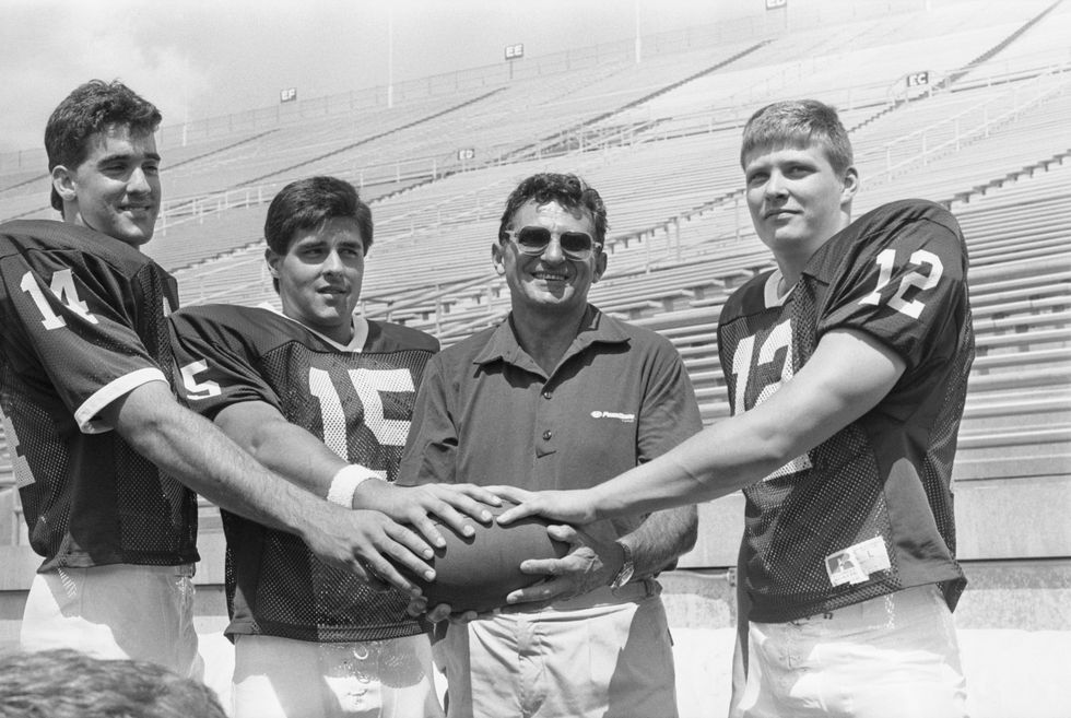 Joe Paterno (C) poses with his three quarterback hopefuls (L-R) Doug Sieg, Lance Lonergan and Tom Bill 1988
