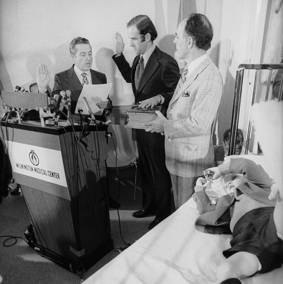 senator joseph biden takes the oath of office from the us senate's secretary, frank valeo with his father in law robert hunter and son joseph beau biden at his side, in beau's hospital room last month beau and his brother robert hunter were injured in an auto accident that killed their mother nealia and younger sister amy senator biden took the oath here with the permission of the senate so that he could remain in wilmington until both children were well beau is in traction while hunter has recovered