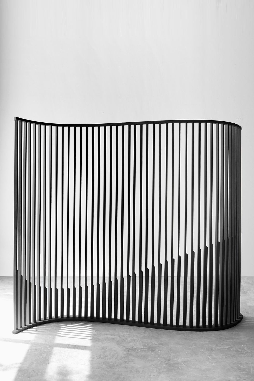 laws of motion room divider in burn wood, space divider screen by joel escalona