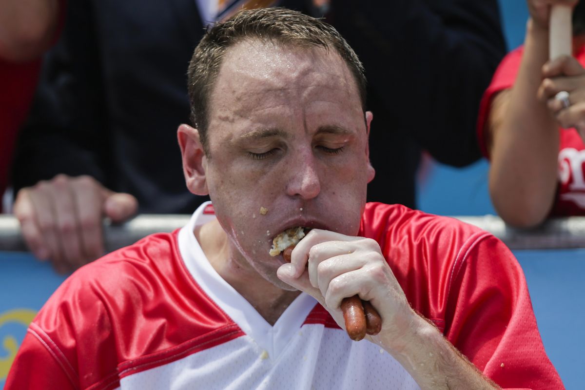 competitive eaters gorge at annual nathan's hot dog eating contest
