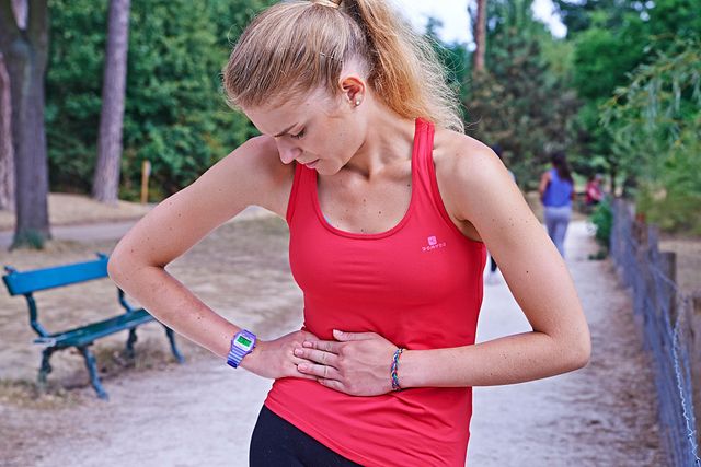 Jogger suffering from a side stitch