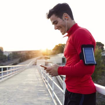 jogger with smartphone in arm pocket