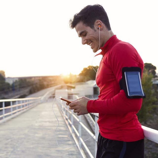 jogger with smartphone in arm pocket