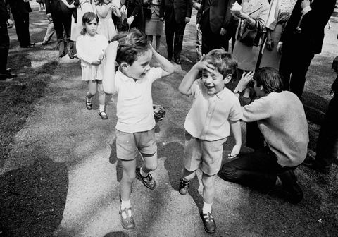 John F. Kennedy Jr. (1960 - 1999) (right), the son of Jackie Kennedy and the late American president walking in Green Park, London with his cousins Anthony and Tina (behind), the children of Jackie's sister Lee Radziwill
