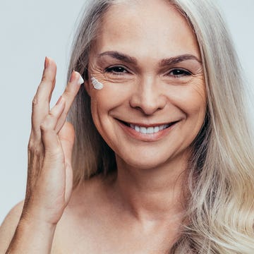Woman applying facial fake tan john lewis facial fake tan