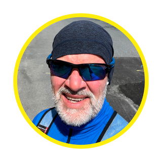 person wearing outdoor gear in a round frame