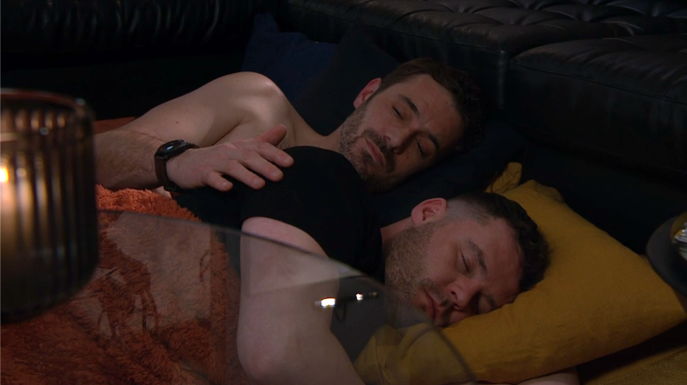 john cuddles aaron, who's asleep, on emmerdale
