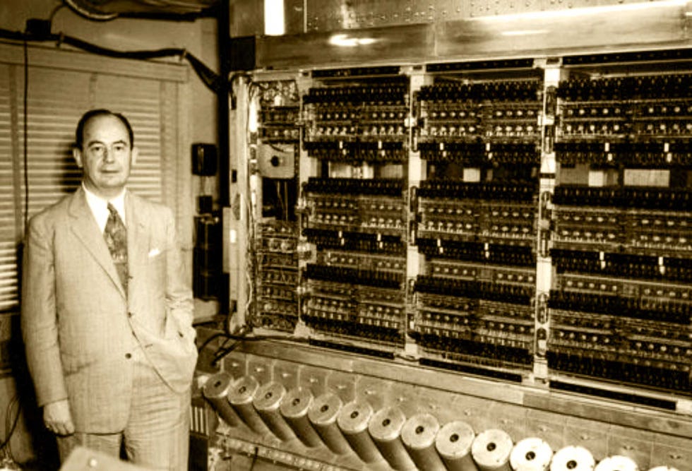 john von neumann with a stored program computer at the institute for advanced study, princeton, new jersey, in 1945