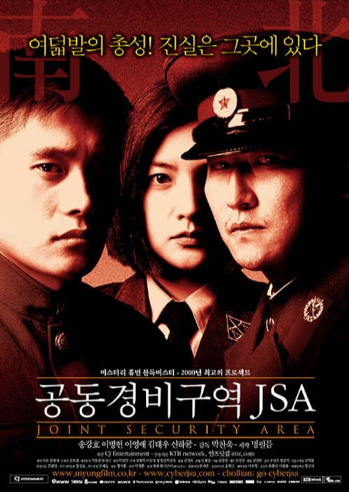 two men and a woman, all in uniform, looking at the camera