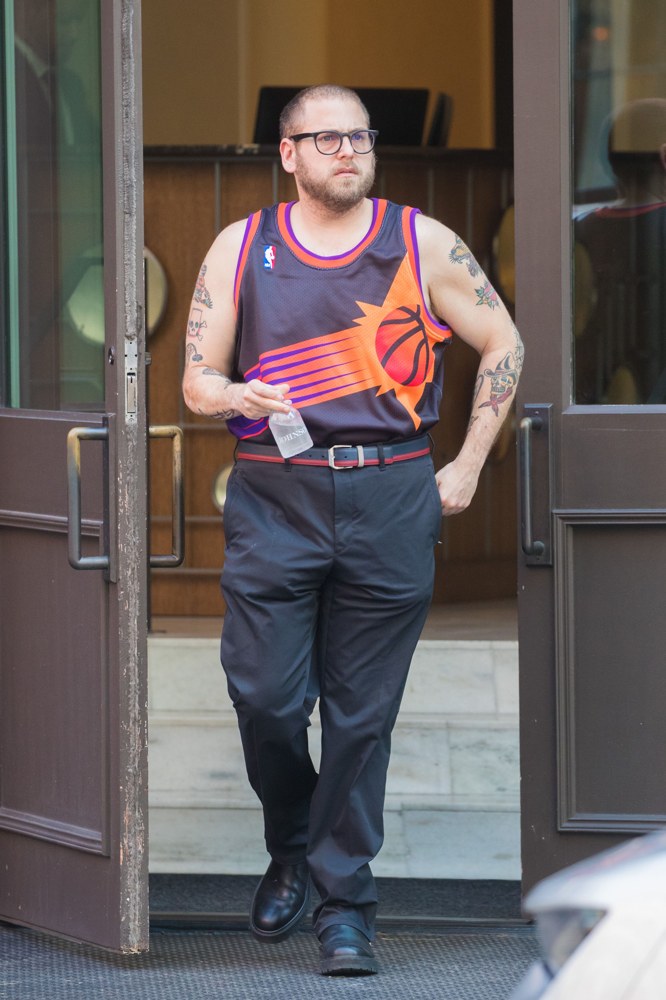Jonah Hill shows off his guns in Phoenix Suns jersey tucked into trousers  while out in New York