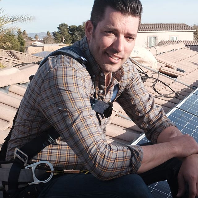 Jonathan Scott's Power Trip Documentary jonathan scott sitting on a roof with solar panels