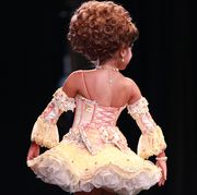 child pageant performer performing her beauty walk during the darling divas candy land beauty pageant at the kimble theatre in brooklyn, new york on july 21, 2012