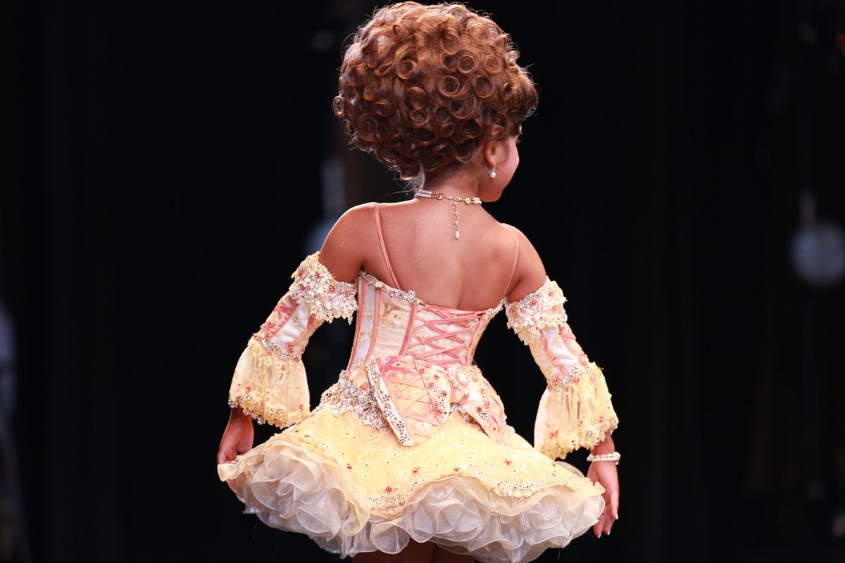 child pageant performer performing her beauty walk during the darling divas candy land beauty pageant at the kimble theatre in brooklyn, new york on july 21, 2012