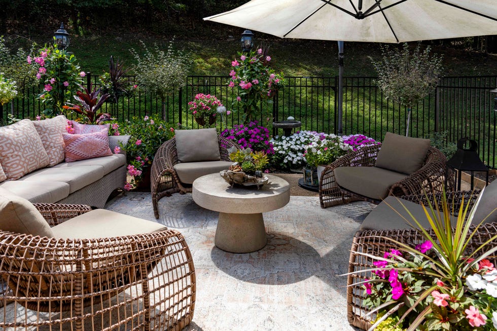 fenced patio with rattan look furniture