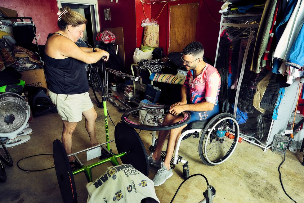 hand cyclist joseph volfman in his garage, also known as his training studio, in august 2021