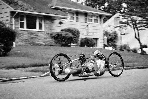 hand cyclist joseph volfman riding the bike outside his home in august 2021