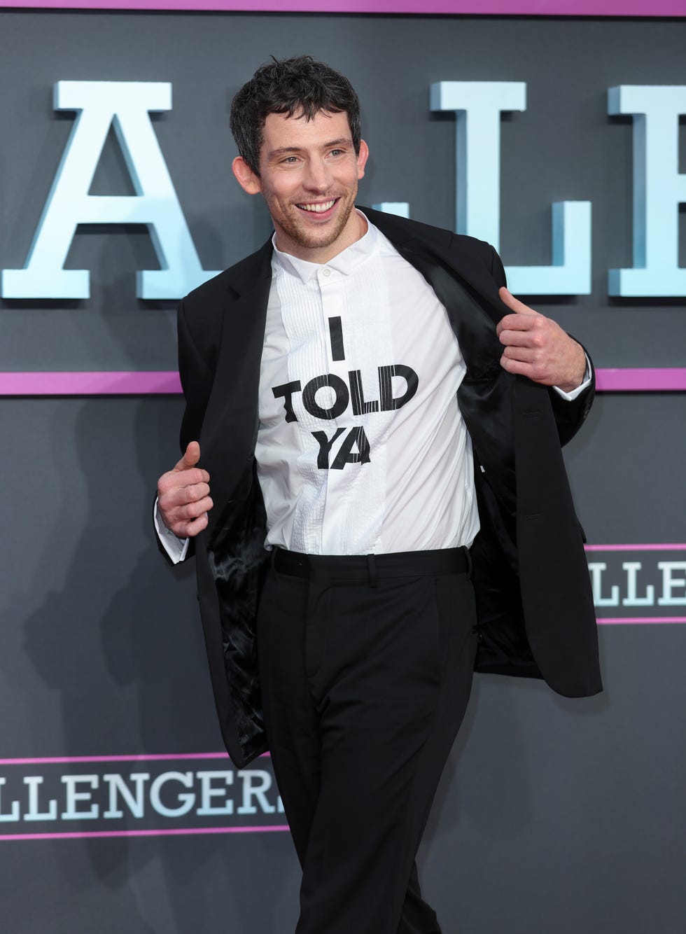 josh o'connor wearing 'i told ya' t shirt at challengers uk premiere