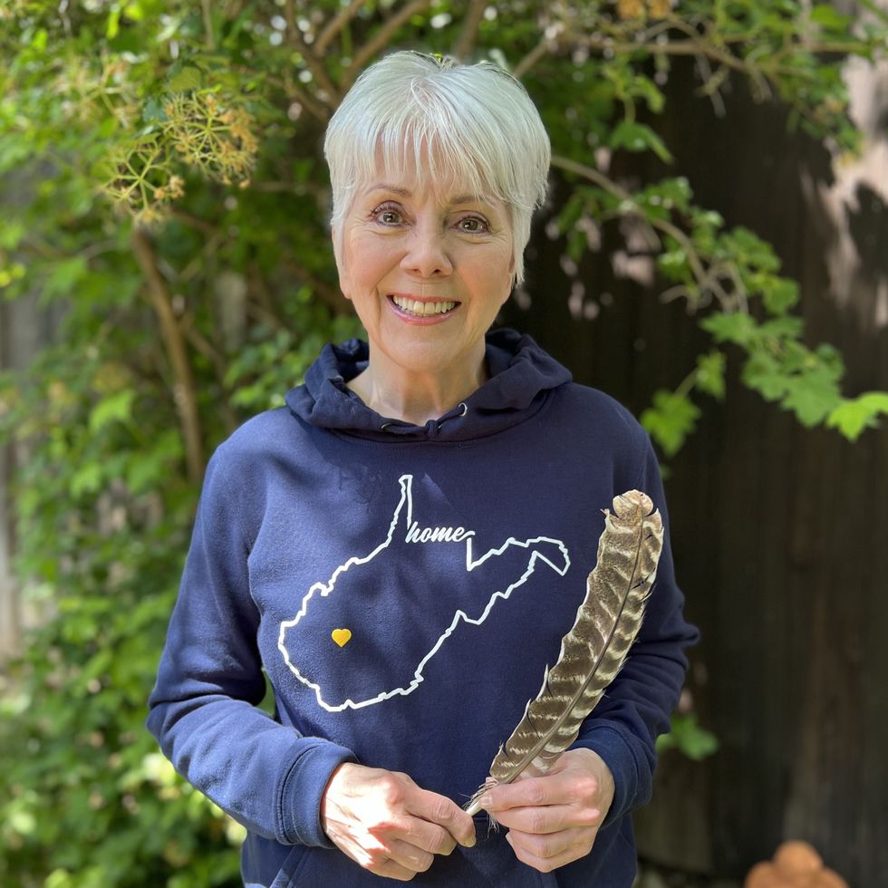 actress joyce dewitt, 74, wearing navy sweatshirt with state of west virginia on it that says home