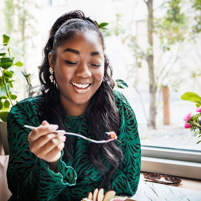 joyful woman enjoying a meal