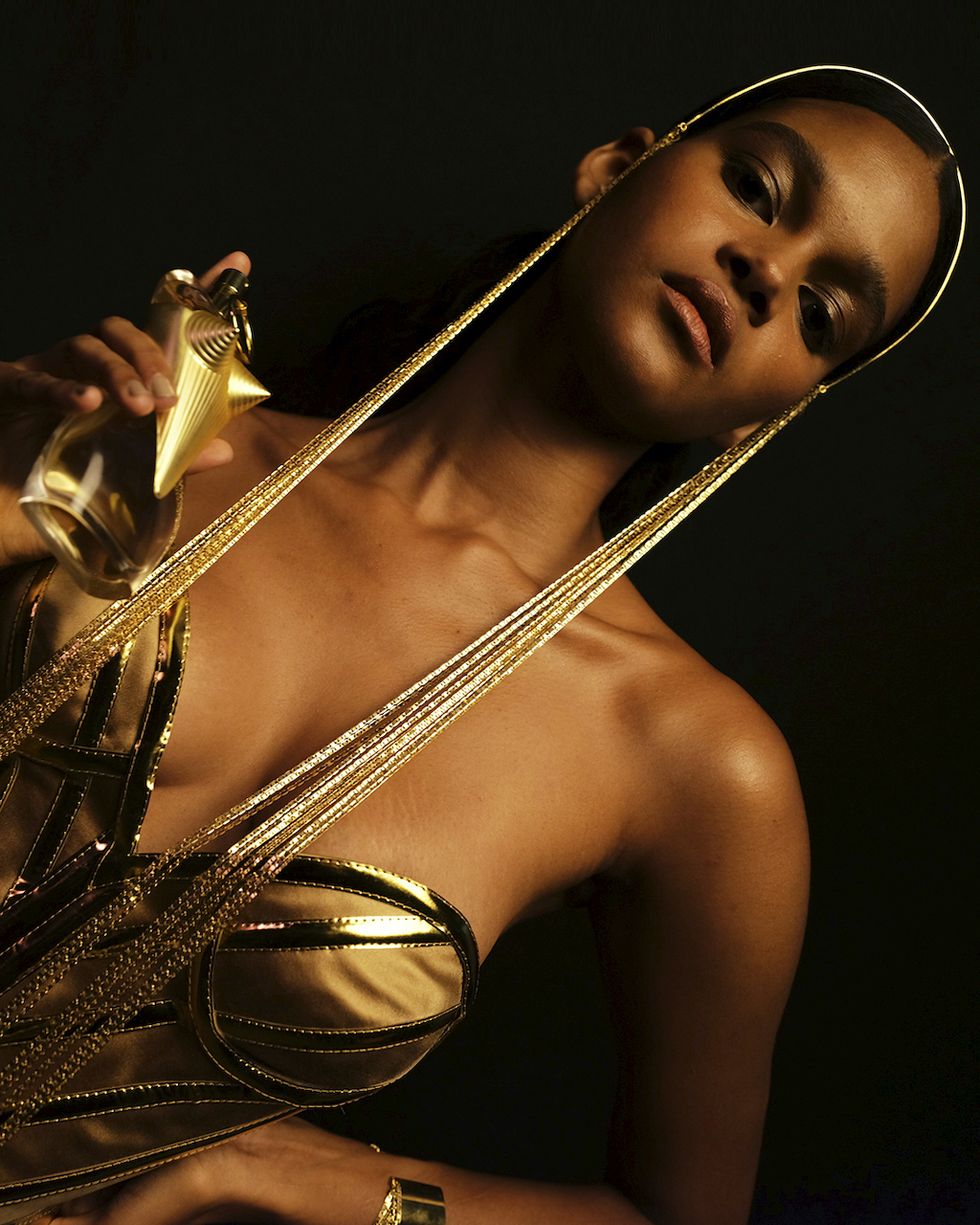 a woman holding a saxophone