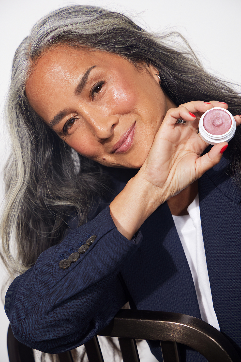 woman holding makeup