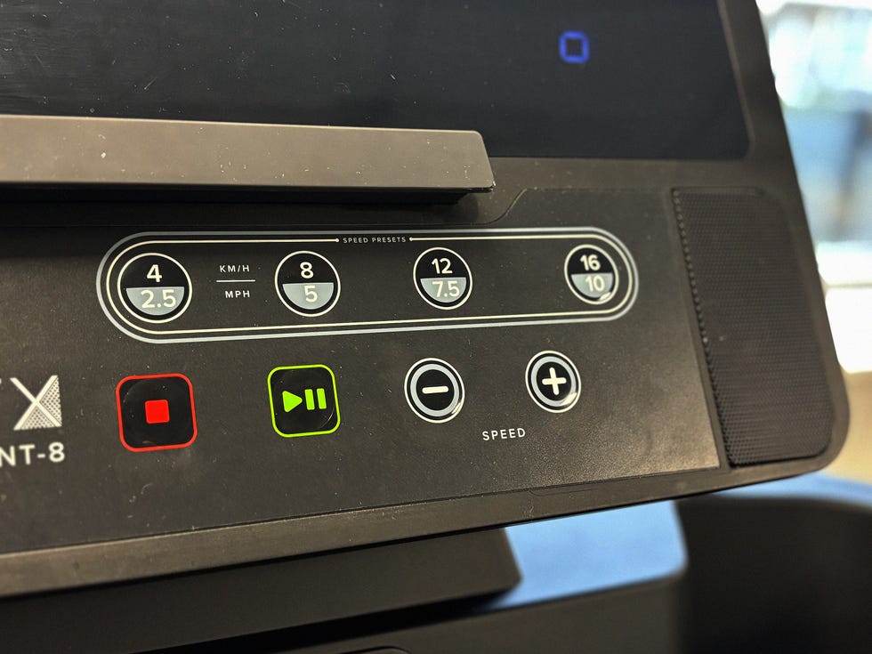close up of buttons on a treadmill screen