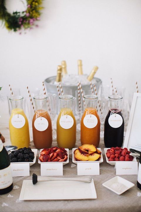 many different juices and fruits on a table