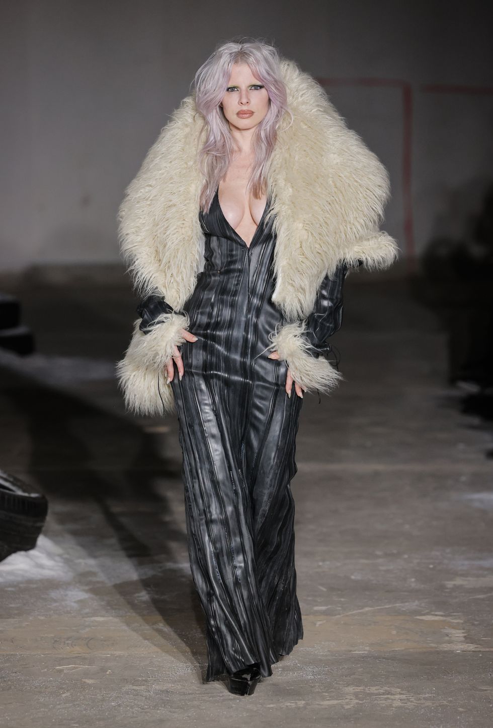 julia fox walks the pressiat aw24 runway during paris fashion week wearing a xl fur collar and plunging dress