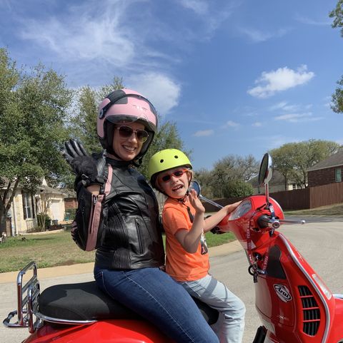 Julie D. enjoying a sunny day and a ride with her son.