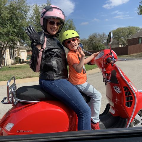 Julie D. enjoying a sunny day and a ride with her son.