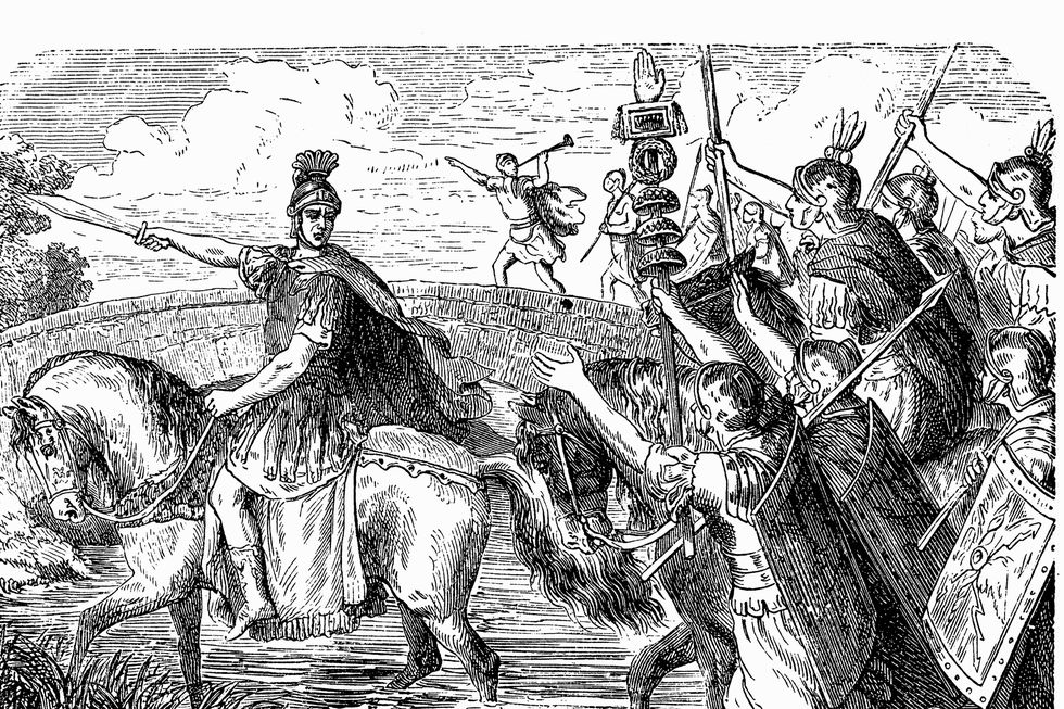 illustration of julius caesar on horseback leading his army across the rubicon river