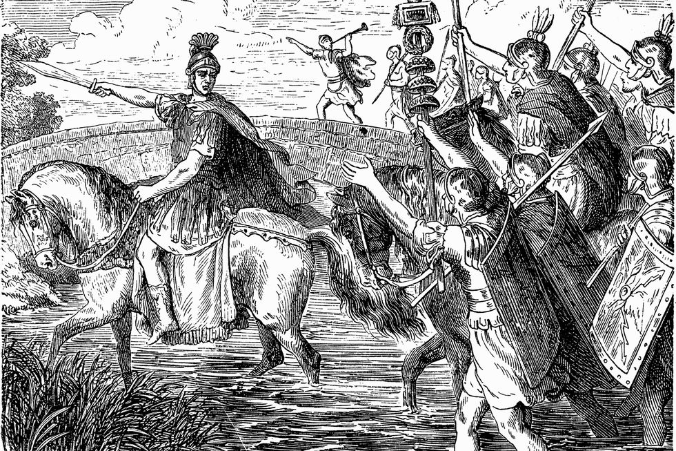 illustration of julius caesar on horseback leading his army across the rubicon river