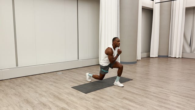 man practicing a lunge exercise