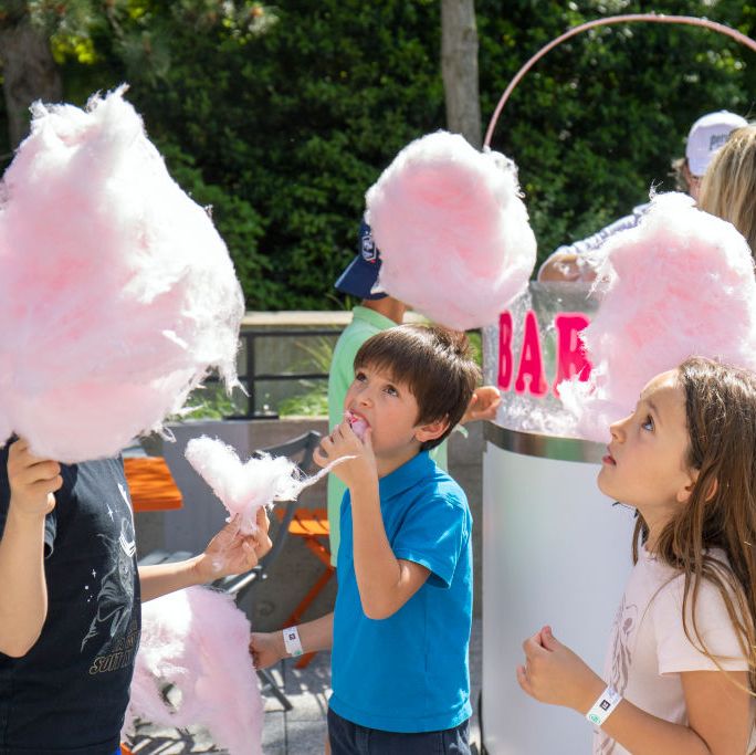 june holidays  children eating cotton candy for national children's day