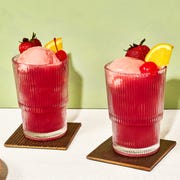 pink punch with raspberry sorbet garnished with a maraschino cherry, orange wedge, and a strawberry pink punch with raspberry sorbet garnished with a maraschino cherry, orange wedge, and a strawberry
