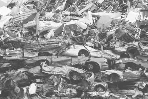 Piles of wrecked cars in a junkyard