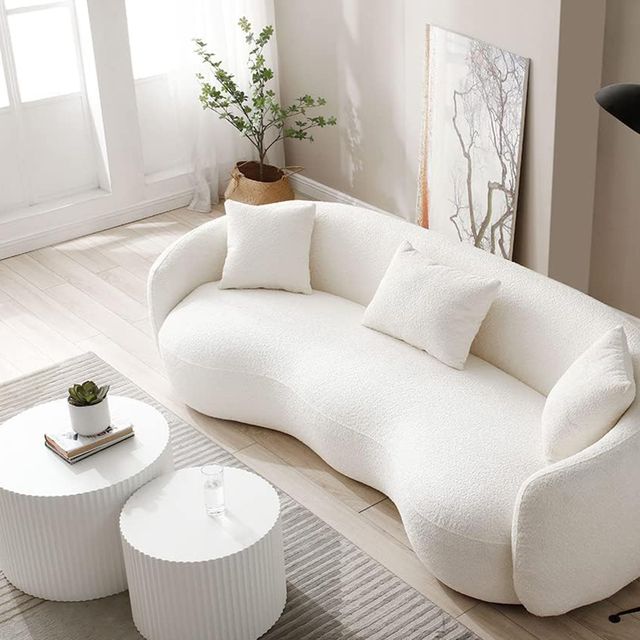 a white couch with a coffee table