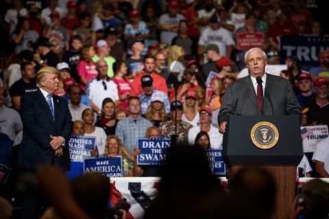 huntington, wv   august 03 west virginia governor jim justice announces that he is switching parties to become a republican as president donald j trump listens on at a campaign rally at the big sandy superstore arena on august 3, 2017 in huntington, west virginia photo by justin merrimangetty images
